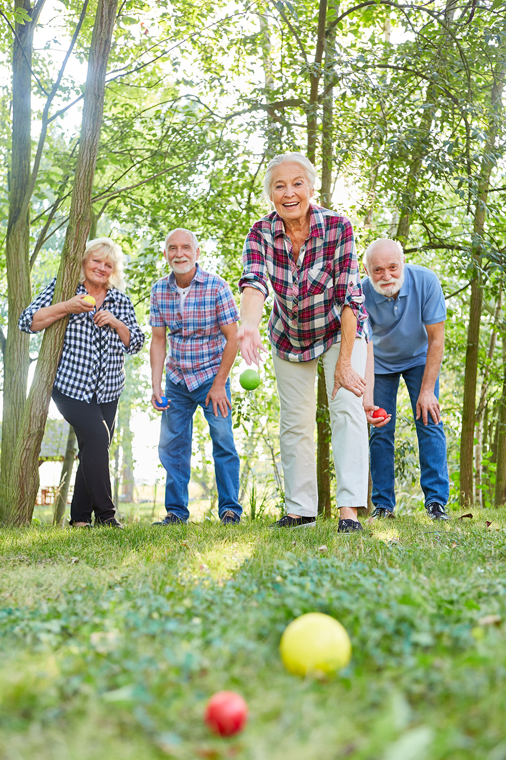 Group,Of,Seniors,Playing,Bocce,Or,Boules,Play,Together,In